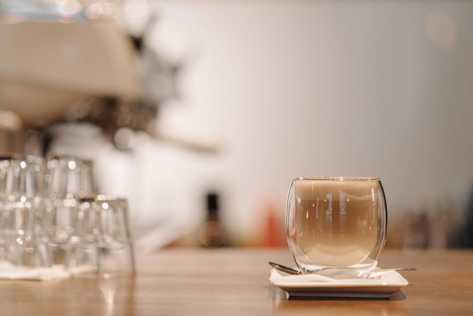 Soft morning light across a café table with two cups